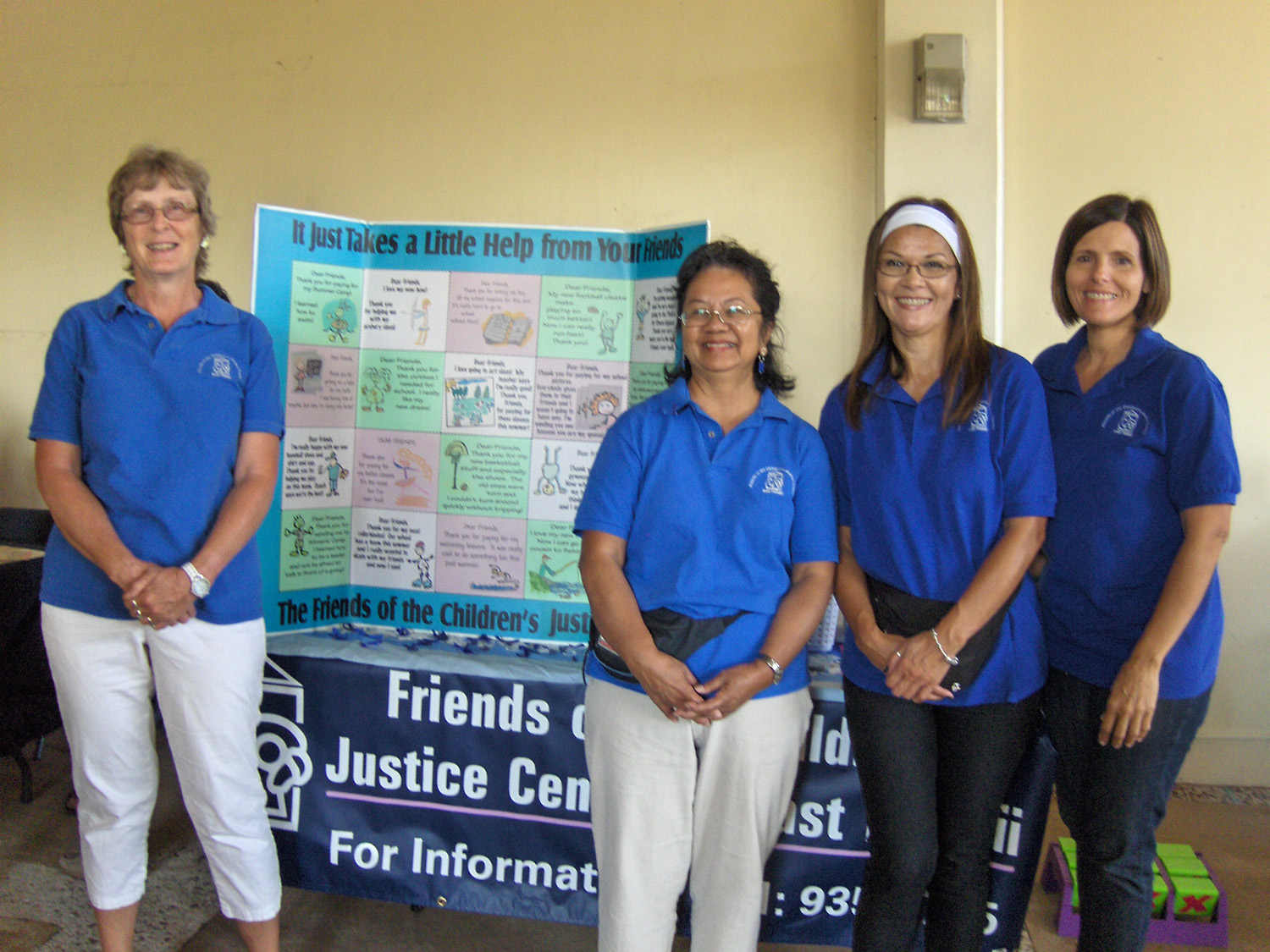 This photo shows Staff and volunteers at a community information Fair.